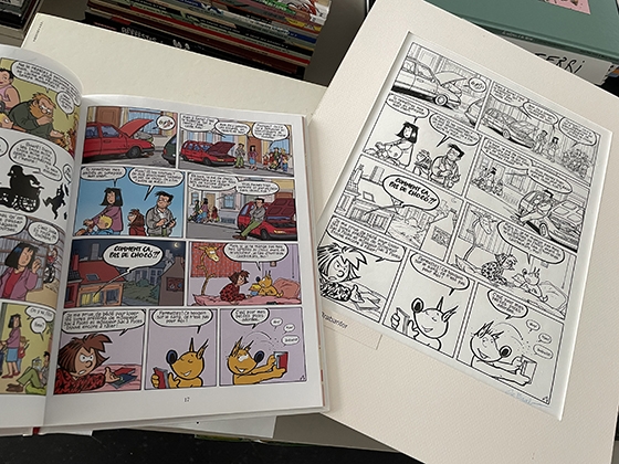 The comic book 'Le Lundi au Soleil' is opened on the same page as the one depicted on its original.